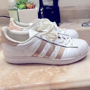 Authentic adidas with rose gold strips and markings